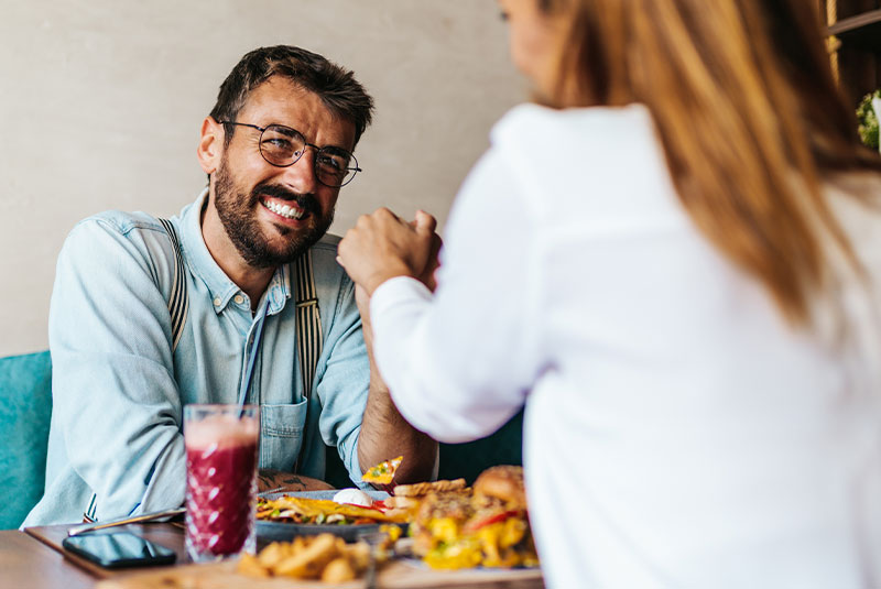 man with woman eating