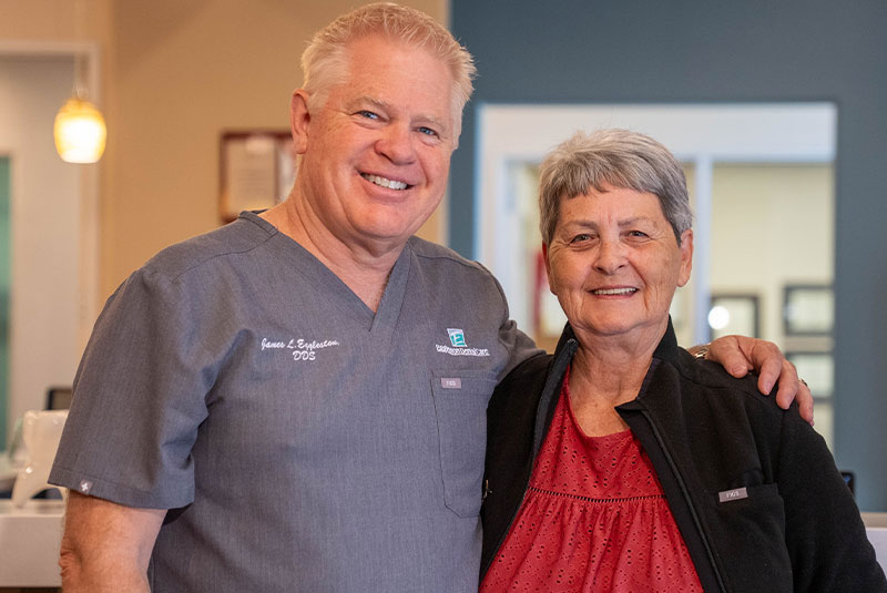 Dentist smiling with Paitent