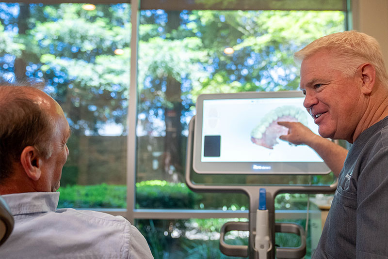 Dentist talking to Paitent about their 3d scan of teeth