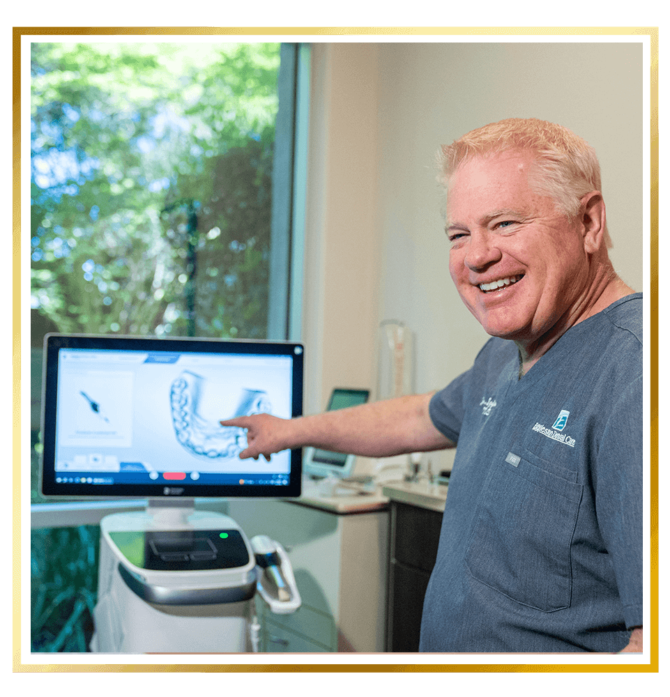 Dentist pointing to a 3d scan of Patients mouth