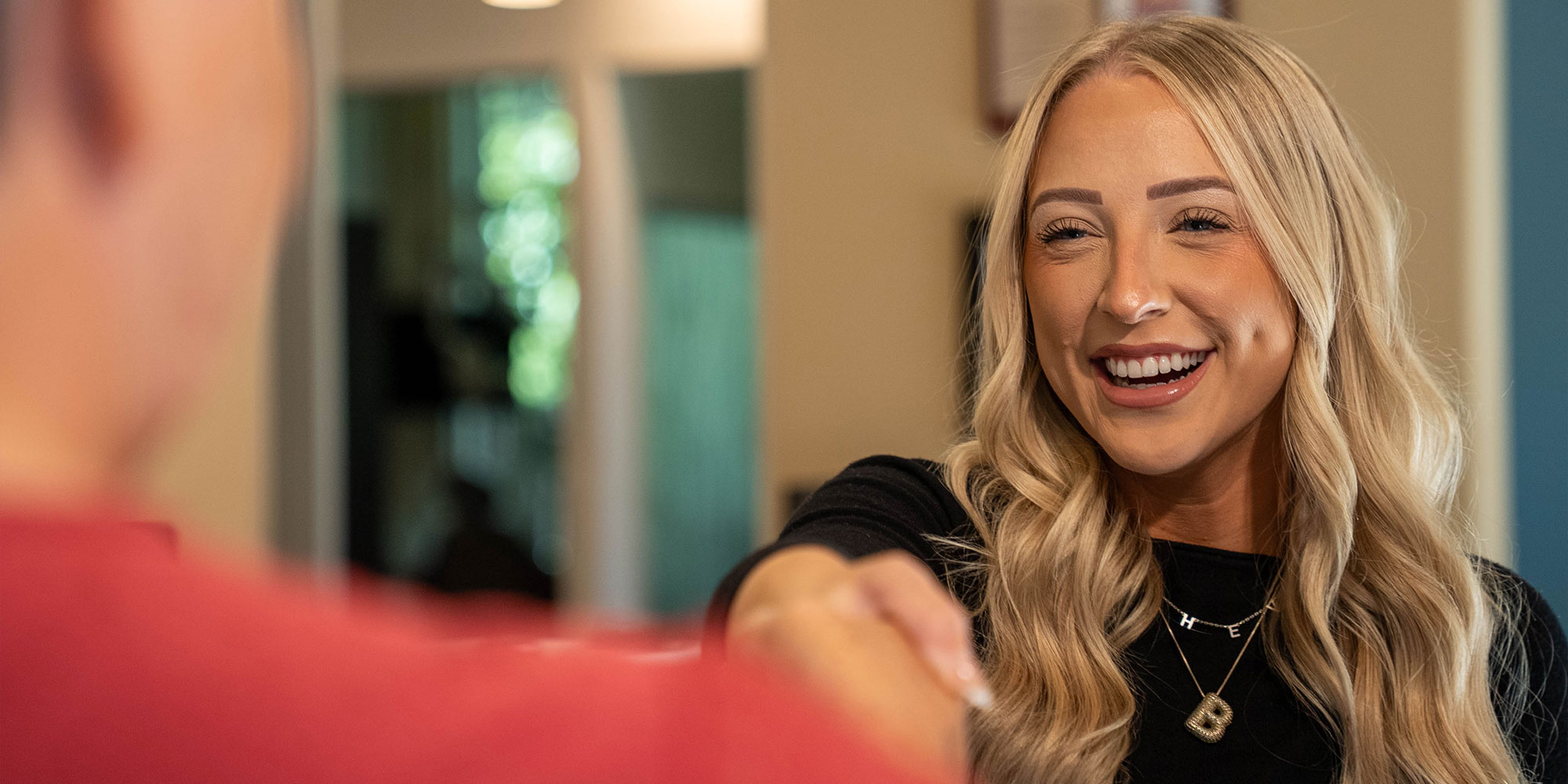 Team member shaking patients hand