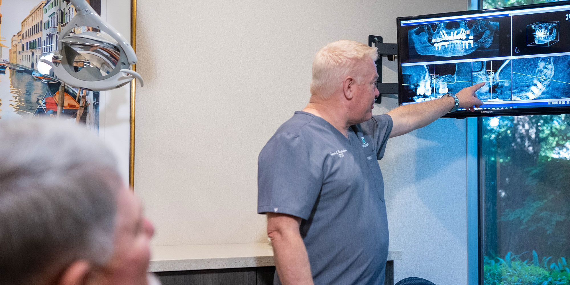 Dentist going over x-ray with Patient