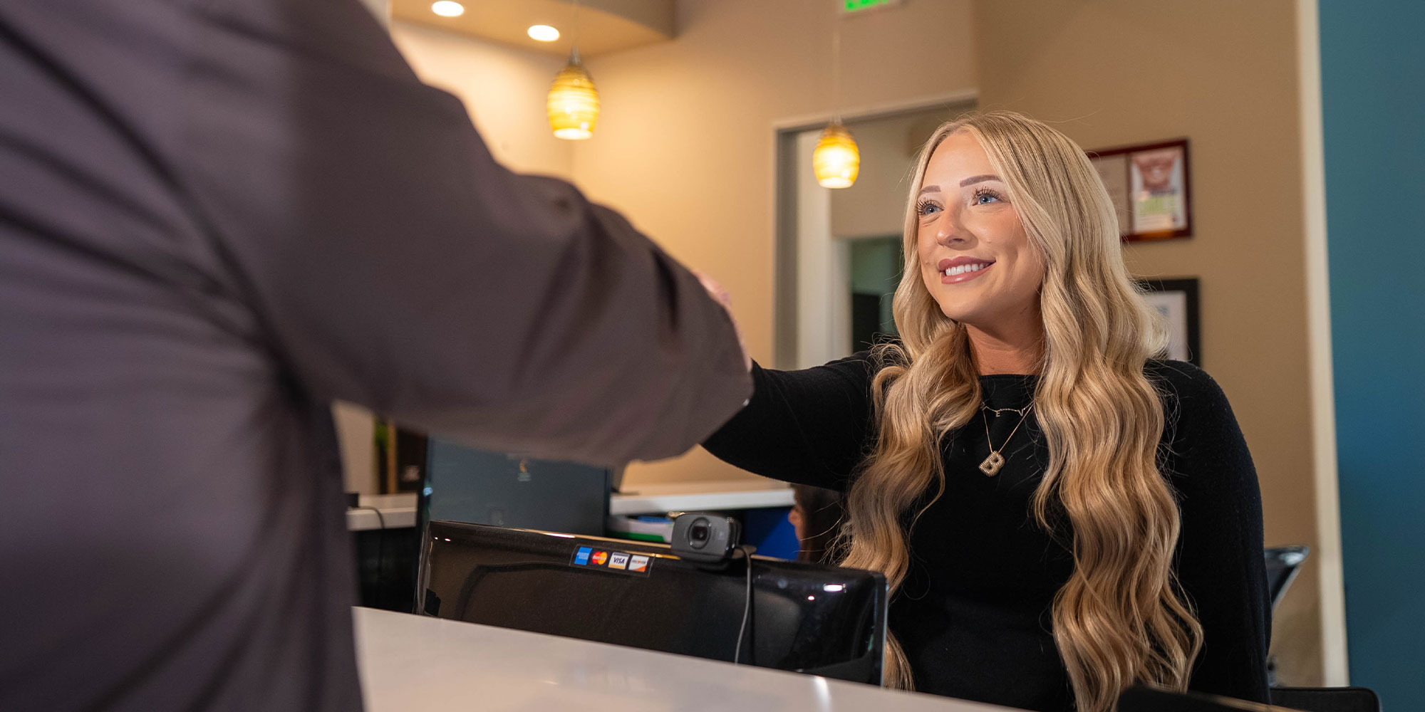 team member shaking Patient's Hand