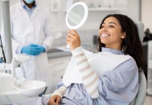 Dentist using a laser tool in a modern dental clinic